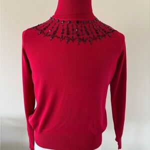 Red Turtleneck Sweater with Black Embellishments